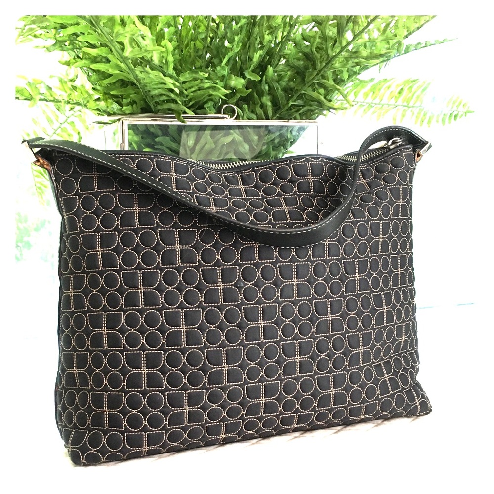 Kate Spade Dot Noel bag with pink interior.